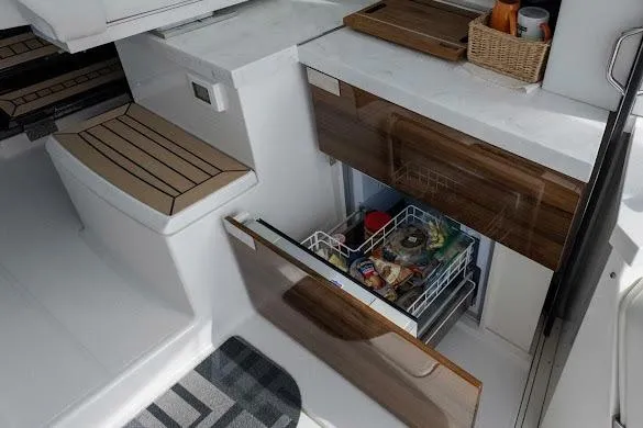 Yacht Photos Pics 2022 Tiara Sport 43 LE yacht interior with open drawer, showcasing modern kitchen amenities.
