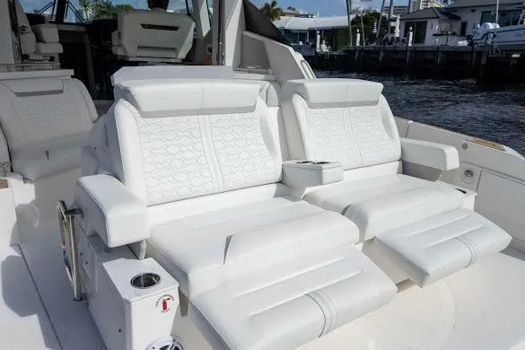  Yacht Photos Pics 2022 Tiara Sport 43 LE luxury boat seating with white upholstery and armrests.