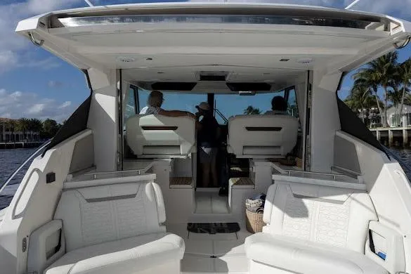  Yacht Photos Pics 2022 Tiara Sport 43 LE luxury boat interior with white seating and modern design.