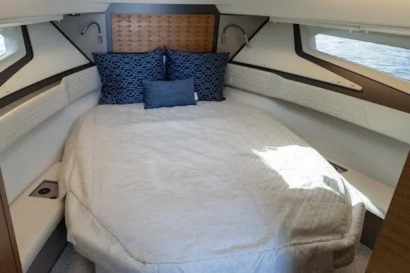  Yacht Photos Pics 2022 Tiara Sport 43 LE cabin with cozy bed and elegant decor.