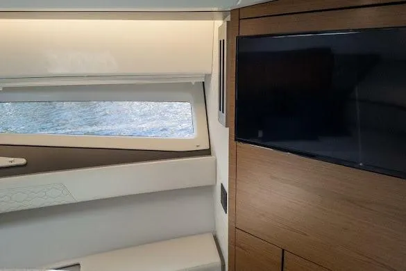  Yacht Photos Pics Interior of 2022 Tiara Sport 43 LE yacht with window and TV.