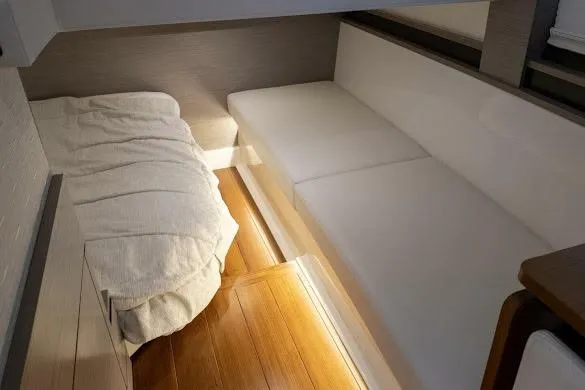  Yacht Photos Pics 2022 Tiara Sport 43 LE interior cabin with cozy bedding and sleek seating.