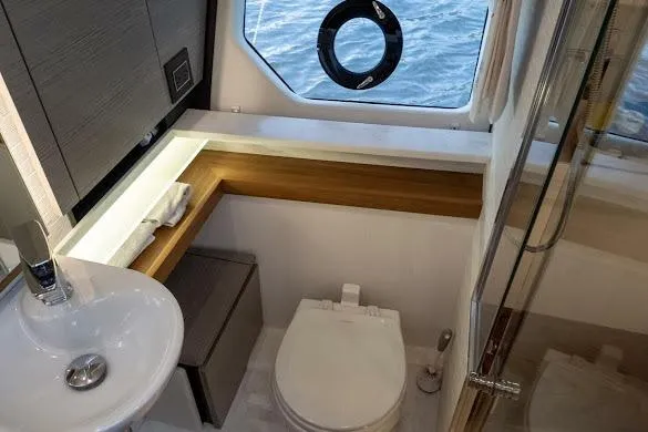  Yacht Photos Pics Luxurious 2022 Tiara Sport 43 LE yacht bathroom with modern fixtures and ocean view.