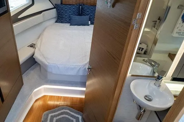  Yacht Photos Pics 2022 Tiara Sport 43 LE cabin interior with bed, sink, and modern decor.