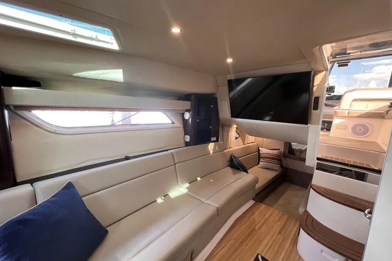  Yacht Photos Pics Luxurious interior of 2016 Regal 35 Sport Coupe with plush seating and modern amenities.