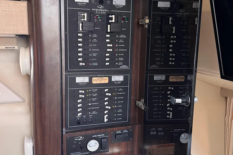  Yacht Photos Pics Electrical control panel of a 2016 Regal 35 Sport Coupe boat interior.