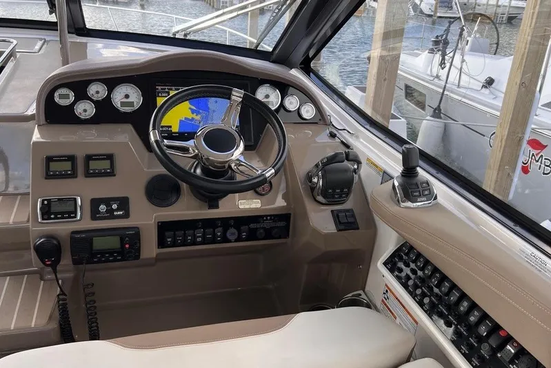  Yacht Photos Pics Cockpit of 2016 Regal 35 Sport Coupe with navigation and control systems.