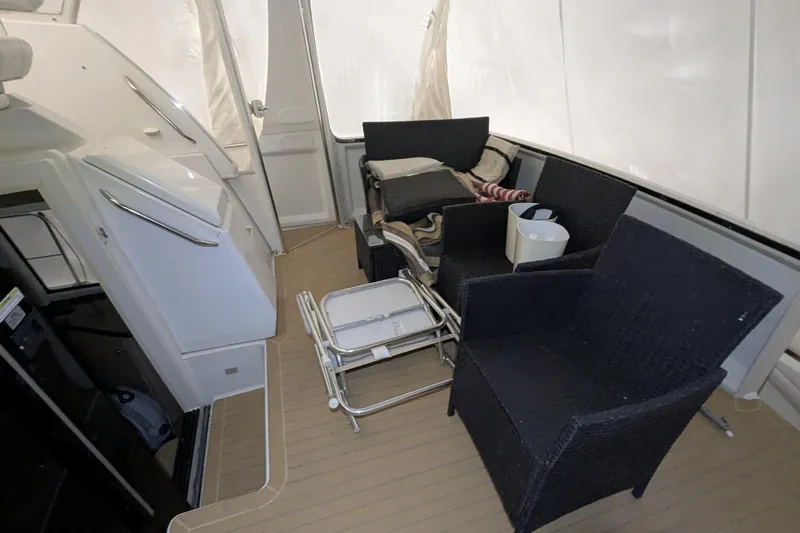 Synchronicity Yacht Photos Pics 2000 Carver 404 Cockpit Motor Yacht interior with seating and storage.