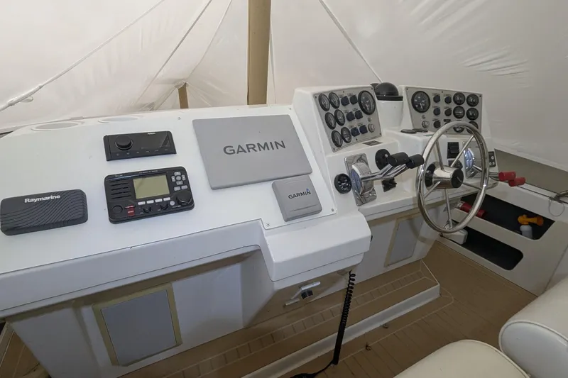Synchronicity Yacht Photos Pics Cockpit of 2000 Carver 404 Motor Yacht with Garmin and Raymarine navigation systems.