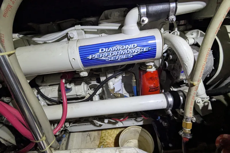 Synchronicity Yacht Photos Pics Engine compartment of 2000 Carver 404 Cockpit Motor Yacht, featuring Diamond Performance Series components.