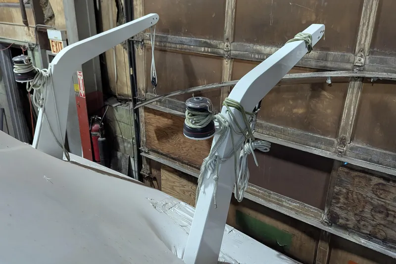 Synchronicity Yacht Photos Pics 2000 Carver 404 Cockpit Motor Yacht in a workshop, showing rigging and equipment.