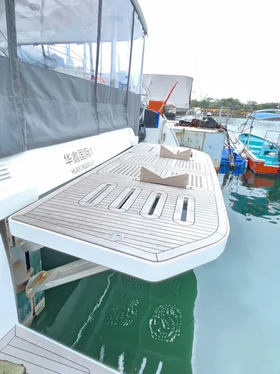  Yacht Photos Pics 2025 Heysea Seaview 56 yacht with extended swim platform in marina.