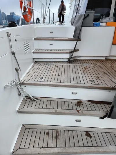  Yacht Photos Pics Steps on a 2025 Heysea Seaview 56 yacht with wooden decking.