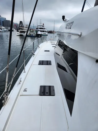  Yacht Photos Pics 2025 Heysea Seaview 56 yacht docked in a marina, showcasing sleek design and modern features.