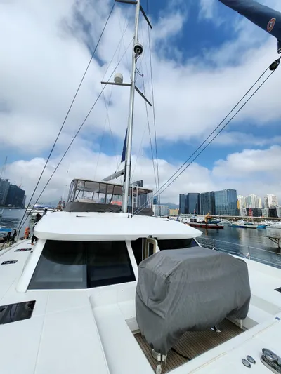  Yacht Photos Pics 2025 Heysea Seaview 56 yacht docked in a marina under a partly cloudy sky.