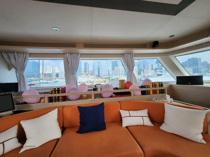  Yacht Photos Pics Luxurious Heysea Seaview 56 yacht interior, 2025 model, with cityscape view through large windows.