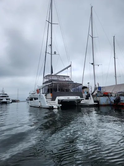  Yacht Photos Pics 2025 Heysea Seaview 56 yacht docked in a marina on a cloudy day.