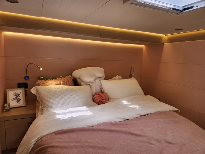  Yacht Photos Pics Luxurious bedroom interior of 2025 Heysea Seaview 56 yacht with cozy bedding and ambient lighting.