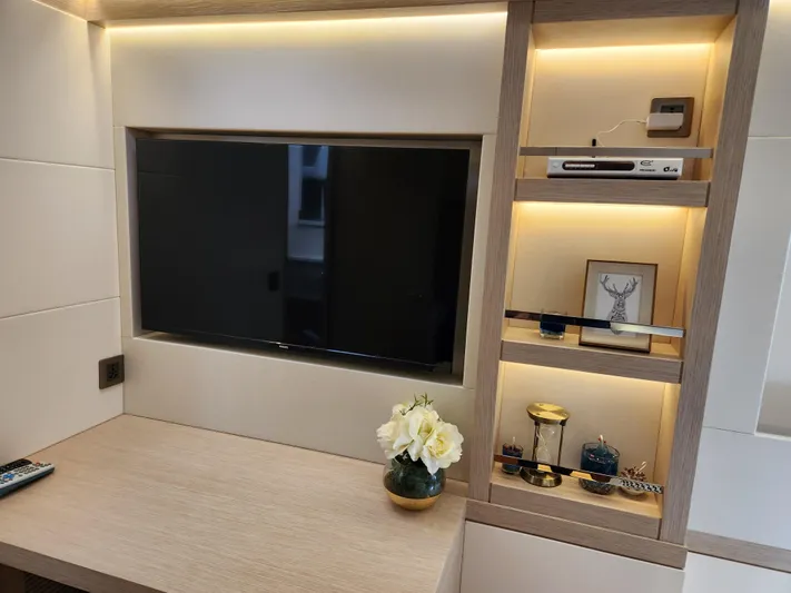  Yacht Photos Pics Luxurious Heysea Seaview 56 yacht interior with modern TV and elegant shelving, 2025 model.