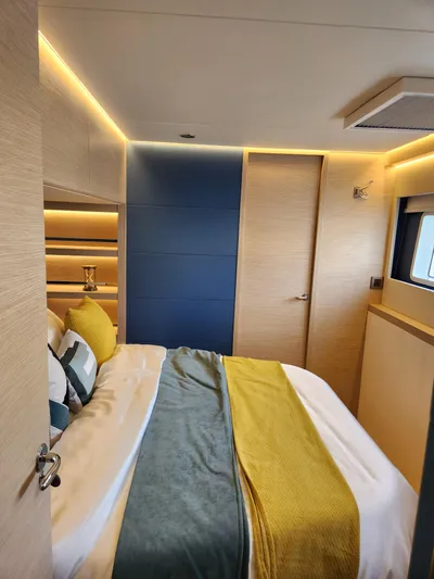  Yacht Photos Pics Luxurious bedroom interior of 2025 Heysea Seaview 56 yacht with modern design and ambient lighting.