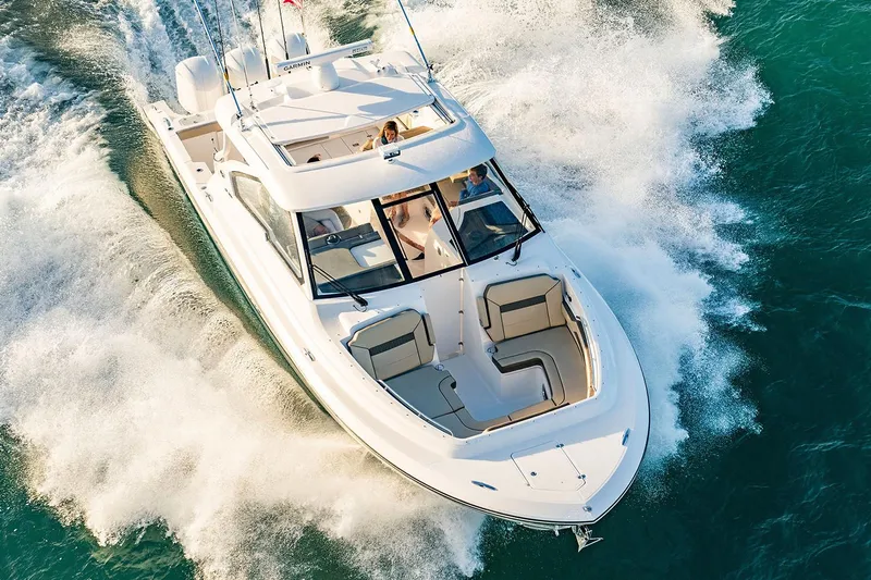  Yacht Photos Pics Manufacturer Provided Image: 2018 Pursuit DC 365 Dual Console boat cruising on water.