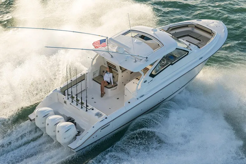  Yacht Photos Pics Manufacturer Provided Image: 2018 Pursuit DC 365 Dual Console boat cruising on water.