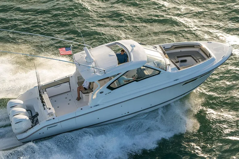  Yacht Photos Pics Manufacturer Provided Image: 2018 Pursuit DC 365 Dual Console boat cruising on the water.