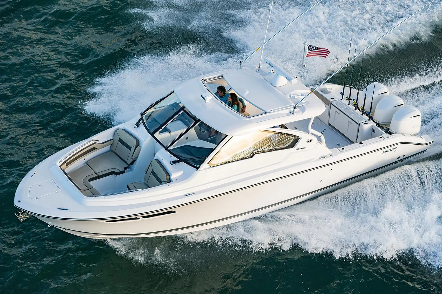 Manufacturer Provided Image: 2018 Pursuit DC 365 Dual Console boat cruising on water.