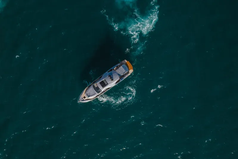 M/y "ghep" Yacht Photos Pics Aerial view of 2022 Pershing 7X yacht cruising in open sea.
