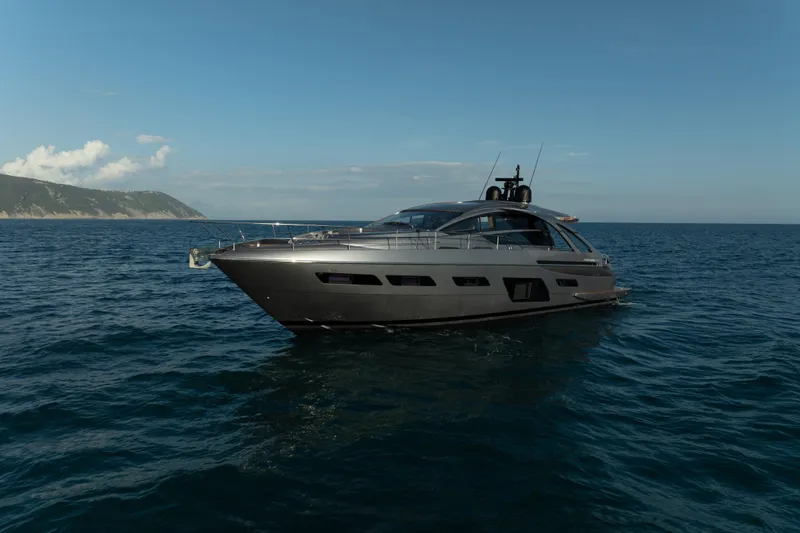 M/y "ghep" Yacht Photos Pics 2022 Pershing 7X yacht cruising on open sea under clear blue sky.