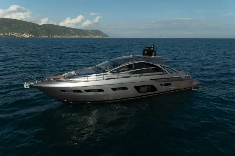 M/y "ghep" Yacht Photos Pics Luxurious 2022 Pershing 7X yacht cruising on open sea with scenic coastline.