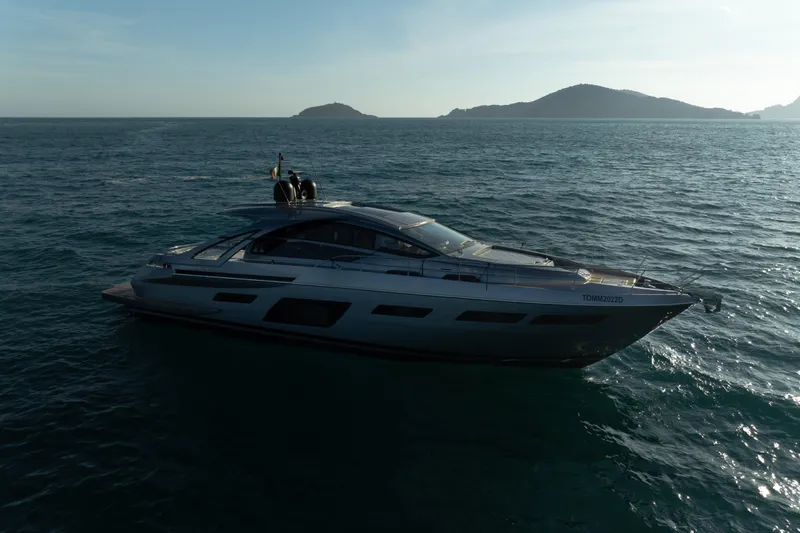 M/y "ghep" Yacht Photos Pics Luxury Pershing 7X yacht cruising on open sea, 2022 model, with scenic island backdrop.