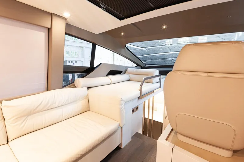 M/y "ghep" Yacht Photos Pics Luxurious interior of 2022 Pershing 7X yacht with modern seating and panoramic windows.