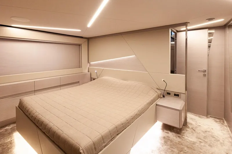 M/y "ghep" Yacht Photos Pics Luxurious bedroom interior of 2022 Pershing 7X yacht with modern design and ambient lighting.