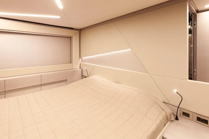 M/y "ghep" Yacht Photos Pics Luxurious bedroom interior of 2022 Pershing 7X yacht with modern lighting and elegant design.