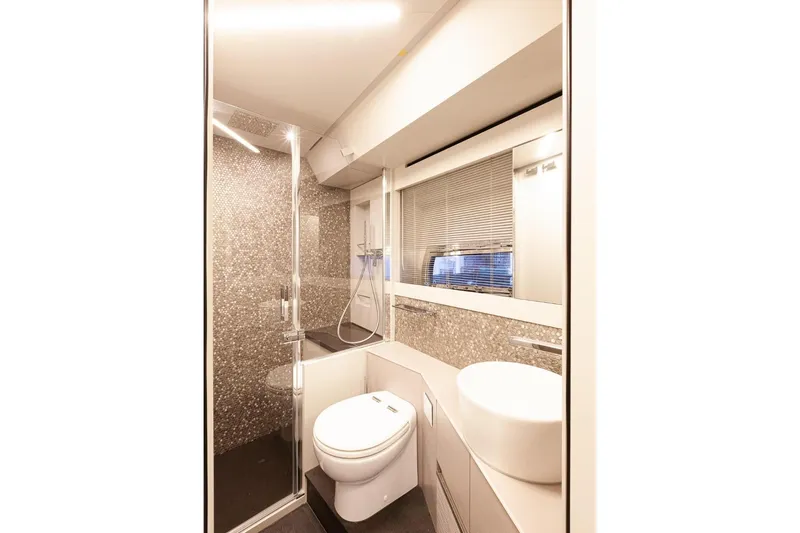 M/y "ghep" Yacht Photos Pics Luxurious bathroom in 2022 Pershing 7X yacht with modern fixtures and elegant design.