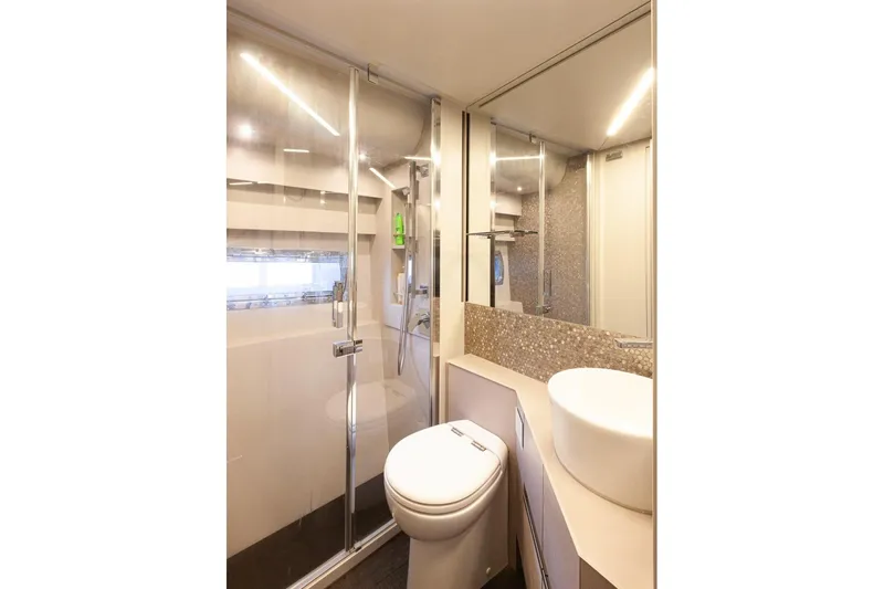 M/y "ghep" Yacht Photos Pics Luxurious bathroom in 2022 Pershing 7X yacht with modern fixtures and elegant design.