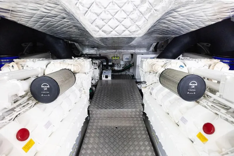 M/y "ghep" Yacht Photos Pics Engine room of 2022 Pershing 7X yacht with dual MAN engines and metallic flooring.