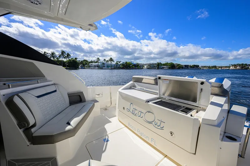 Let It Out Yacht Photos Pics 2022 Tiara Yachts 43 LE with seating and grill, docked in Boca Raton, Florida.