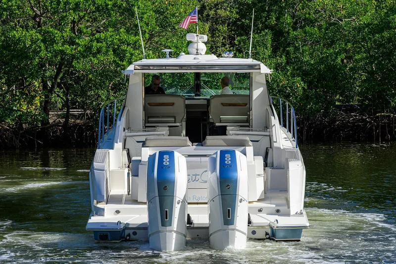 Let It Out Yacht Photos Pics 2022 Tiara Yachts 43 LE with dual 600 horsepower engines cruising on a river.