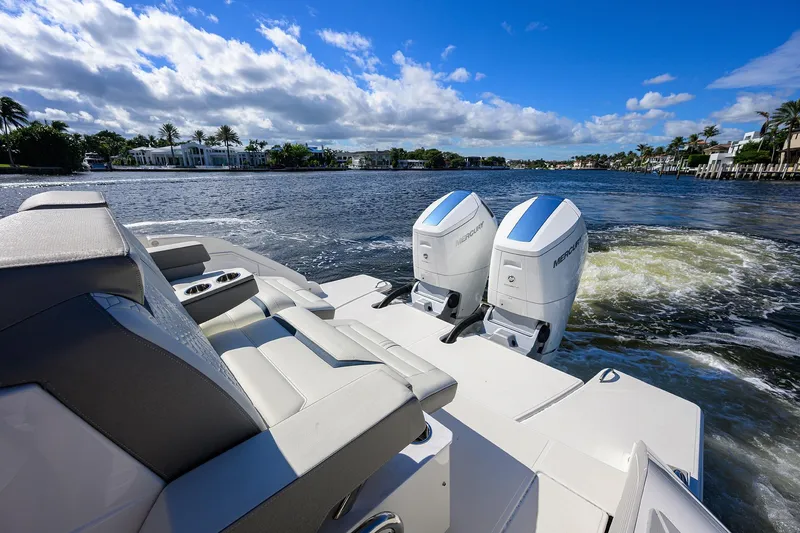 Let It Out Yacht Photos Pics 2022 Tiara Yachts 43 LE with dual Mercury engines on a sunny waterway.