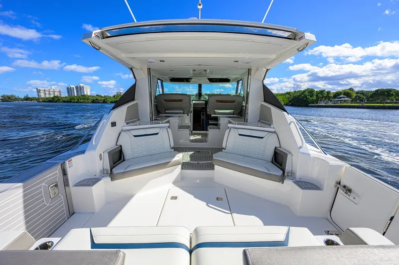 Let It Out Yacht Photos Pics Luxury 2022 Tiara Yachts 43 LE boat interior with seating, on a sunny day.