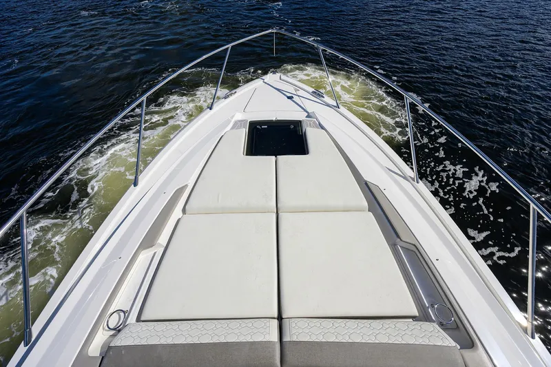 Let It Out Yacht Photos Pics Bow view of 2022 Tiara Yachts 43 LE cruising on water.