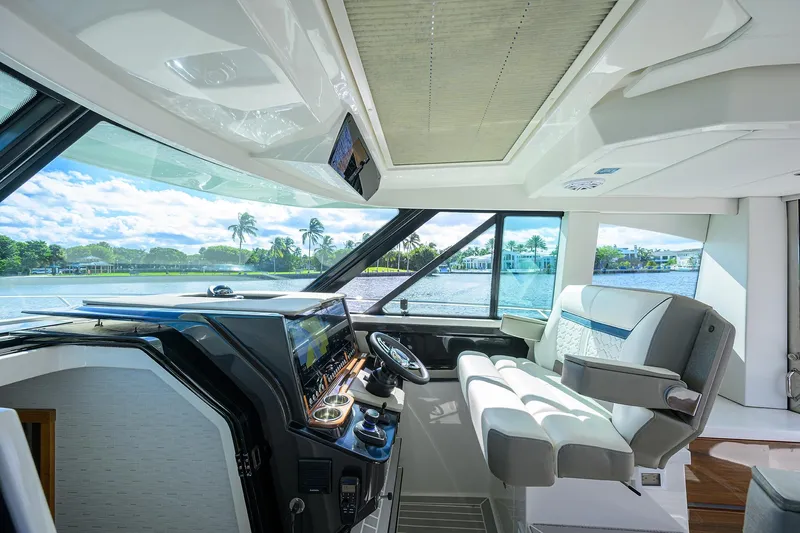 Let It Out Yacht Photos Pics Interior of 2022 Tiara Yachts 43 LE, featuring modern helm and luxurious seating.