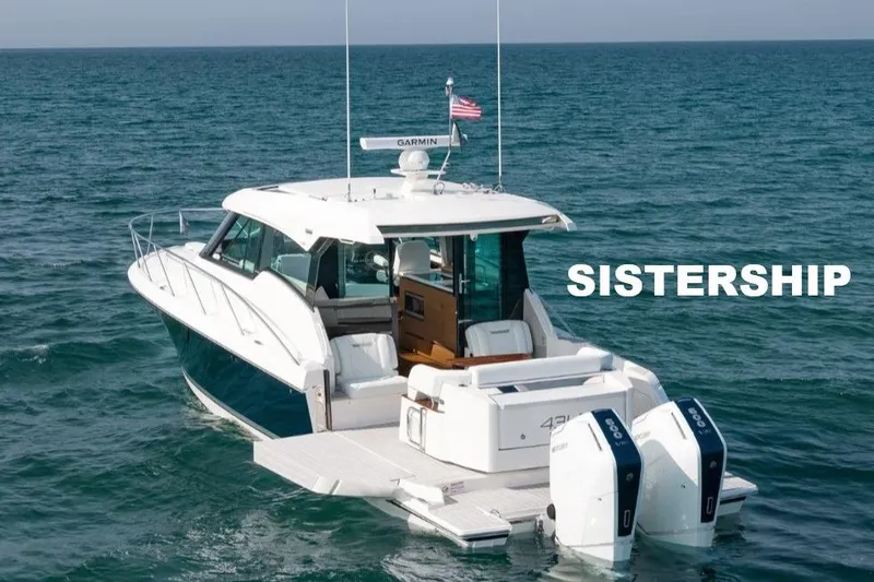 Let It Out Yacht Photos Pics 2022 Tiara Yachts 43 LE cruising on open water, showcasing sleek design and twin engines.