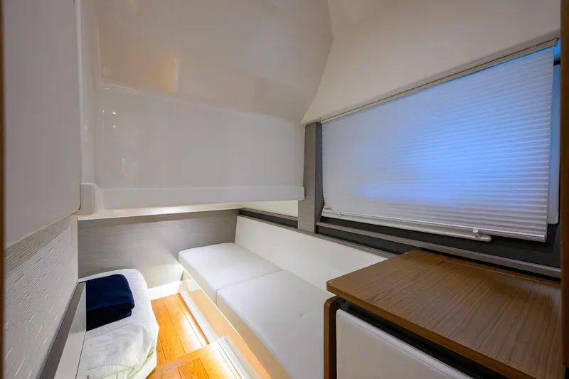 Let It Out Yacht Photos Pics Interior cabin of 2022 Tiara Yachts 43 LE, featuring modern design and comfortable seating.