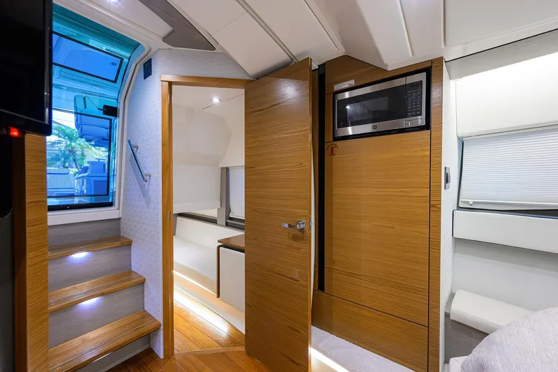 Let It Out Yacht Photos Pics Interior of 2022 Tiara Yachts 43 LE, featuring wooden cabinetry and modern amenities.
