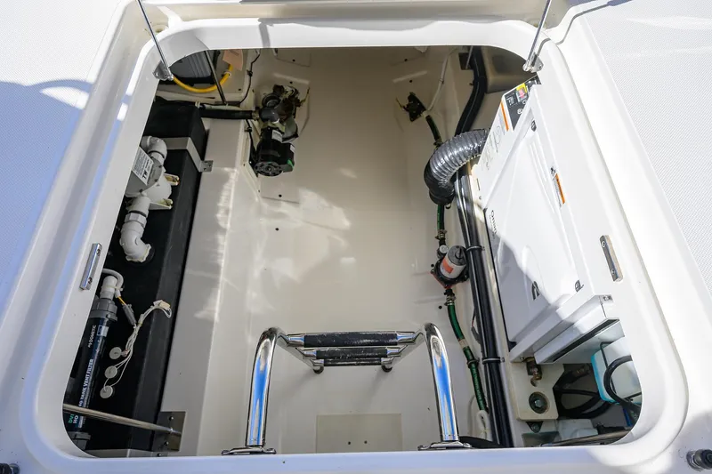 Let It Out Yacht Photos Pics Engine compartment of 2022 Tiara Yachts 43 LE, showcasing mechanical components and systems.