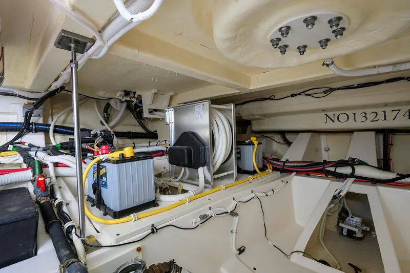 Let It Out Yacht Photos Pics Engine room of 2022 Tiara Yachts 43 LE, showcasing wiring and battery systems.