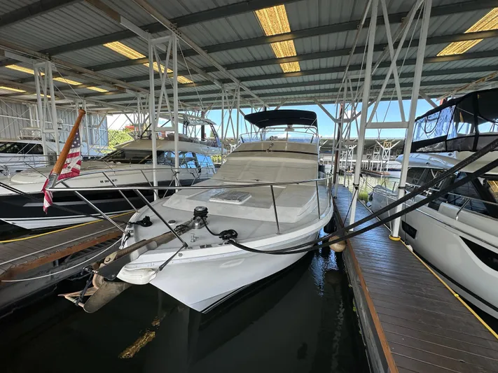  Yacht Photos Pics 1987 Ocean Alexander 46 Cockpit Motor Yacht docked in a covered marina.